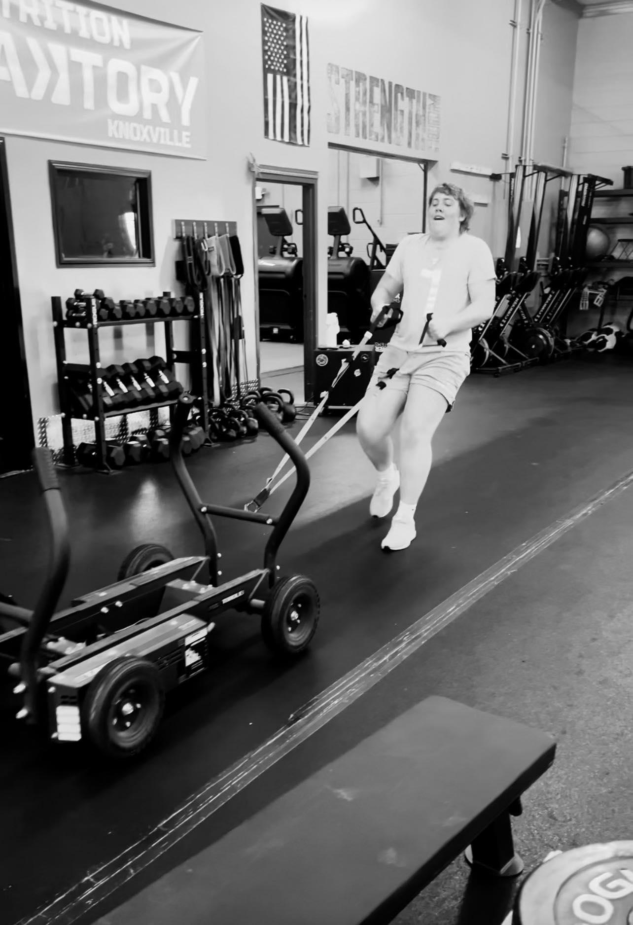 Ethan doing sled pull for strength and agility training